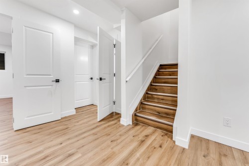Stairway with wood finished floors and recessed lighting - 4616 32 Avenue, Edmonton, AB - Indoor Photo Showing Other Room