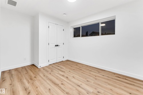 Unfurnished bedroom featuring light wood-style floors and a closet - 4616 32 Avenue, Edmonton, AB - Indoor Photo Showing Other Room