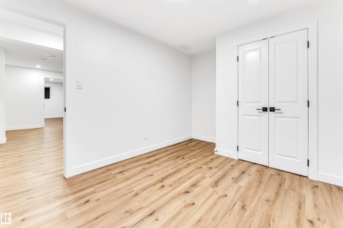 Unfurnished bedroom featuring recessed lighting, light wood-type flooring, and a closet - 4616 32 Avenue, Edmonton, AB - Indoor Photo Showing Other Room