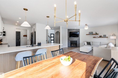 15 Nadine Way, St. Albert, AB - Indoor Photo Showing Dining Room With Fireplace