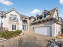 View of front of house featuring a balcony, french doors, driveway, and stucco siding - 1062 Tory Road, Edmonton, AB  - Outdoor 