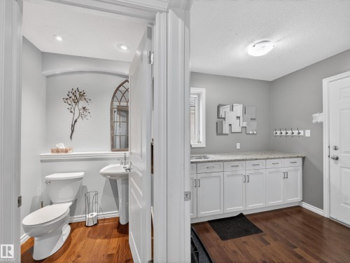 Bathroom with dark wood-type flooring and a textured ceiling - 1062 Tory Road, Edmonton, AB - Indoor Photo Showing Other Room