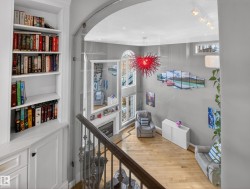Corridor featuring light wood-type flooring and baseboards - 
