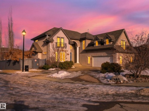 French country inspired facade with concrete driveway and stucco siding - 1062 Tory Road, Edmonton, AB - Outdoor