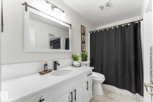 Bathroom with vanity, light tile patterned floors, and shower / tub combo - 13 Heron Link, Spruce Grove, AB - Indoor Photo Showing Bathroom