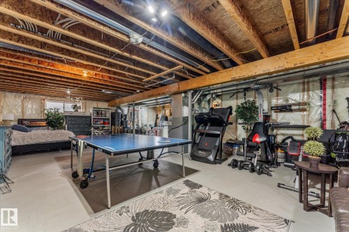 Recreation room featuring concrete floors - 13 Heron Link, Spruce Grove, AB - Indoor Photo Showing Basement