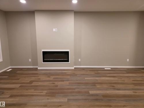 11 Sereno Lane, Fort Saskatchewan, AB - Indoor Photo Showing Other Room With Fireplace