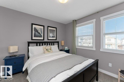 Bedroom with baseboards and light carpet - 2607 20 Avenue, Edmonton, AB - Indoor Photo Showing Bedroom