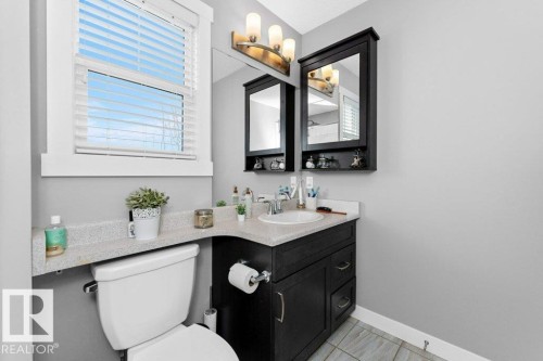 Half bath featuring toilet and vanity - 2607 20 Avenue, Edmonton, AB - Indoor Photo Showing Bathroom