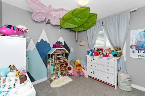 Recreation room featuring carpet flooring and a textured ceiling - 2607 20 Avenue, Edmonton, AB - Indoor Photo Showing Other Room