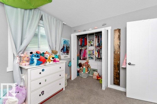 Bedroom featuring light colored carpet and a closet - 2607 20 Avenue, Edmonton, AB - Indoor