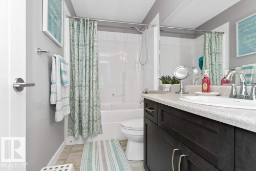 Bathroom with vanity and shower / tub combo with curtain - 2607 20 Avenue, Edmonton, AB - Indoor Photo Showing Bathroom