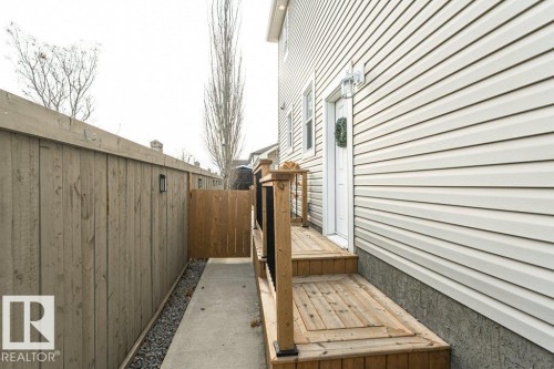 View of home's exterior featuring a wooden deck - 2607 20 Avenue, Edmonton, AB - Outdoor With Exterior