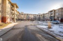 View of asphalt street with sidewalks - 422 7909 71 Street, Edmonton, AB  - Outdoor With Balcony With Facade 