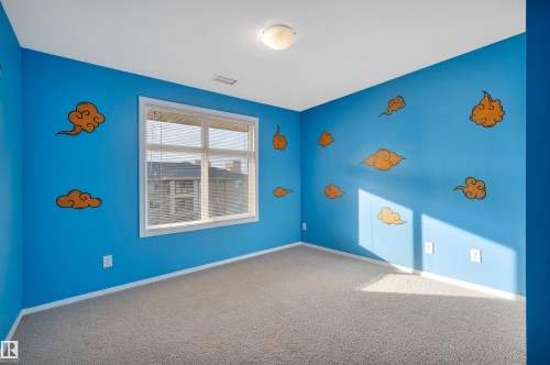 Carpeted spare room featuring baseboards - 422 7909 71 Street, Edmonton, AB - Indoor Photo Showing Other Room