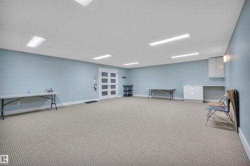 Finished basement featuring light carpet and baseboards - 422 7909 71 Street, Edmonton, AB - Indoor
