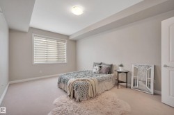 Bedroom featuring carpet flooring and baseboards - 