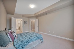 Bedroom with carpet and ensuite bath - 