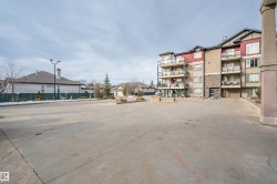 View of street featuring curbs, sidewalks, and street lights - 