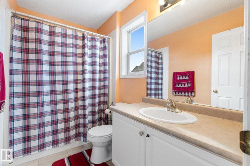Full bathroom with vanity and a textured ceiling - 13148 151 Avenue, Edmonton, AB - Indoor Photo Showing Bathroom
