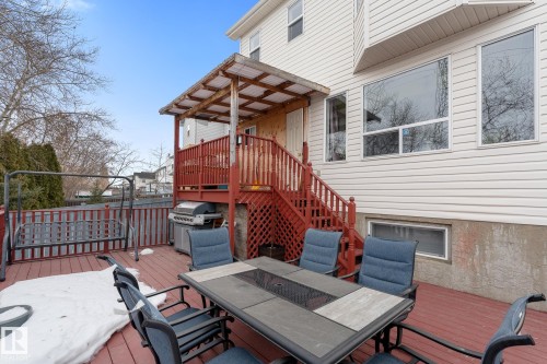 Wooden terrace featuring outdoor dining space and grilling area - 13148 151 Avenue, Edmonton, AB - Outdoor With Deck Patio Veranda With Exterior