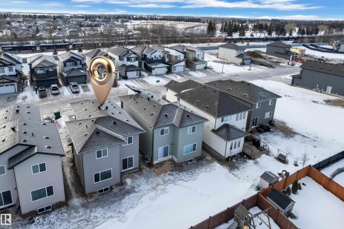 Snowy aerial view featuring a residential view - 68 Silverstone Drive, Stony Plain, AB - Outdoor
