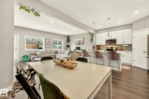 Dining room featuring dark wood-type flooring and recessed lighting - 74 Royal Street, St. Albert, AB - Indoor