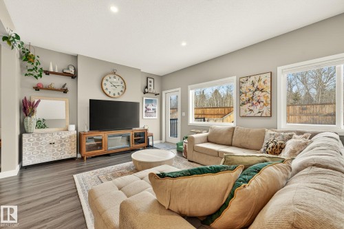 Living area featuring wood finished floors and recessed lighting - 74 Royal Street, St. Albert, AB - Indoor Photo Showing Living Room