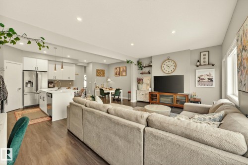 Living area featuring dark wood finished floors and recessed lighting - 74 Royal Street, St. Albert, AB - Indoor Photo Showing Living Room