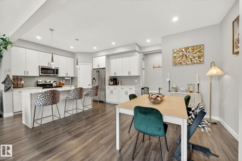 Dining area with baseboards and dark wood-style floors - 74 Royal Street, St. Albert, AB - Indoor