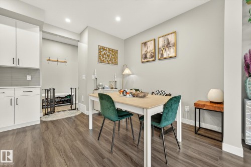 Dining area featuring dark wood-style floors and recessed lighting - 74 Royal Street, St. Albert, AB - Indoor Photo Showing Dining Room