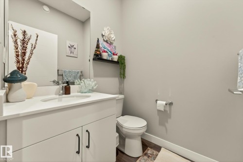 Bathroom featuring vanity and dark wood-style flooring - 74 Royal Street, St. Albert, AB - Indoor Photo Showing Bathroom