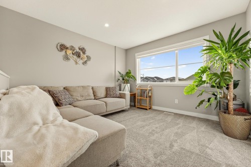 Carpeted living area with baseboards and recessed lighting - 74 Royal Street, St. Albert, AB - Indoor Photo Showing Living Room