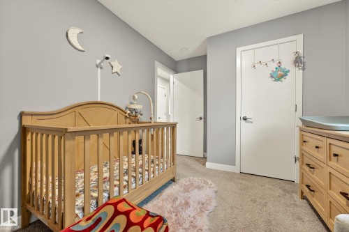 Bedroom featuring a nursery area and light carpet - 74 Royal Street, St. Albert, AB - Indoor Photo Showing Bedroom
