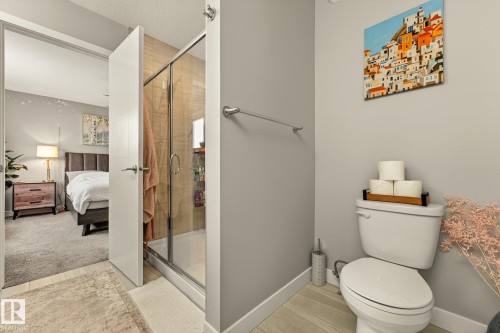 Bathroom with a shower stall, ensuite bath, and a textured ceiling - 74 Royal Street, St. Albert, AB - Indoor Photo Showing Bathroom