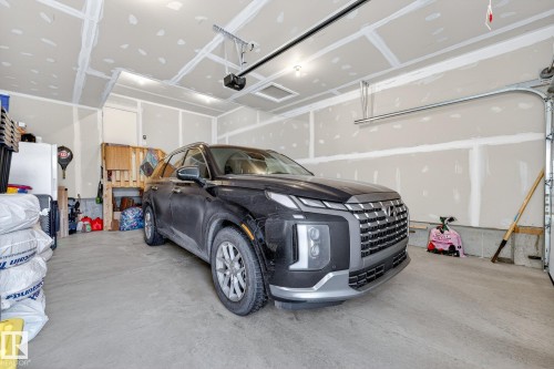 Garage featuring a garage door opener - 74 Royal Street, St. Albert, AB - Indoor Photo Showing Garage