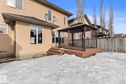 Snow covered house with a gazebo, stucco siding, and a deck - 10655 181 Avenue, Edmonton, AB - Outdoor