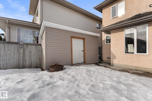 Back of house featuring a patio area, stucco siding, and an outdoor fire pit - 10655 181 Avenue, Edmonton, AB - Outdoor With Exterior