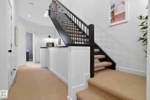 Stairway featuring carpet floors and recessed lighting - 1 9561 143 Street Nw, Edmonton, AB - Indoor Photo Showing Other Room