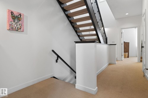 Stairway with carpet floors and recessed lighting - 1 9561 143 Street Nw, Edmonton, AB - Indoor Photo Showing Other Room