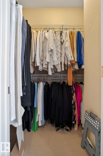 Walk in closet with carpet floors - 1 9561 143 Street Nw, Edmonton, AB - Indoor With Storage
