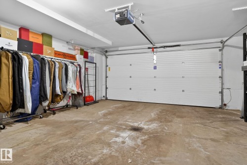 Garage featuring a garage door opener - 1 9561 143 Street Nw, Edmonton, AB - Indoor Photo Showing Garage