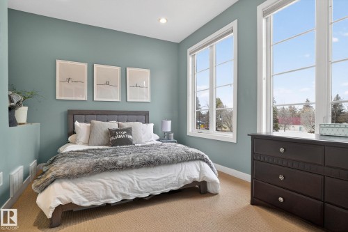 Bedroom featuring baseboards and carpet - 1 9561 143 Street Nw, Edmonton, AB - Indoor Photo Showing Bedroom