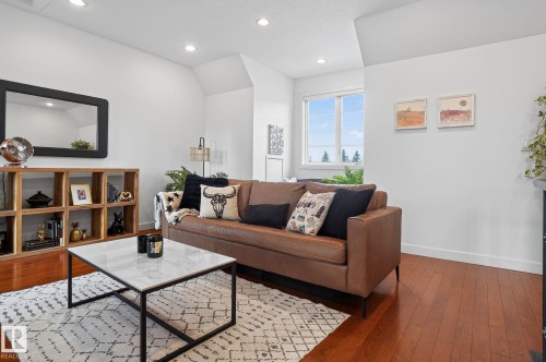 Living area with hardwood / wood-style floors and recessed lighting - 1 9561 143 Street Nw, Edmonton, AB - Indoor Photo Showing Living Room