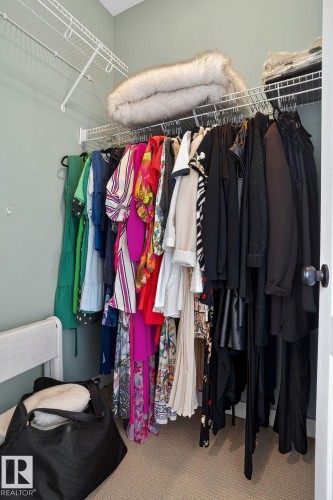 Walk in closet with carpet flooring - 1 9561 143 Street Nw, Edmonton, AB - Indoor With Storage