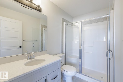 Bathroom with a shower stall and vanity - 90 Dansereau Way N, Beaumont, AB - Indoor Photo Showing Bathroom