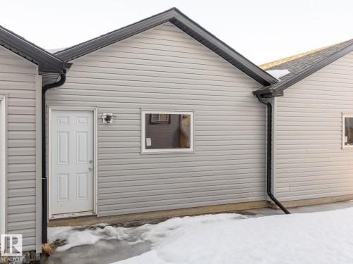View of side of home - 90 Dansereau Way N, Beaumont, AB - Outdoor With Exterior