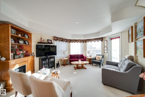 411 6703 172 Street, Edmonton, AB - Indoor Photo Showing Living Room With Fireplace