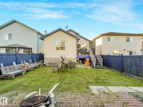 Back of house with a fire pit, a patio area, and a fenced backyard - 3239 21 Street, Edmonton, AB - Outdoor With Deck Patio Veranda