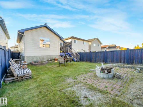 Fenced backyard with a fire pit - 3239 21 Street, Edmonton, AB - Outdoor